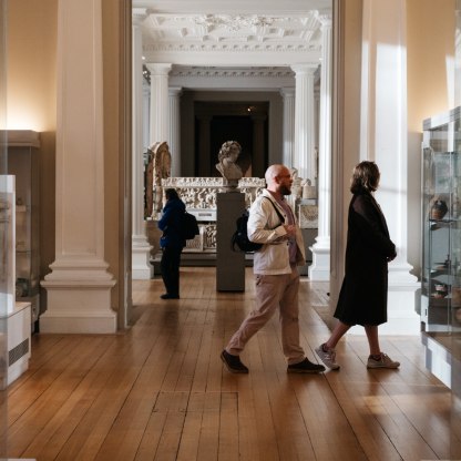 A highlight image for Photograph of a man and woman walking through the galleries at the Fitzwilliam Museum